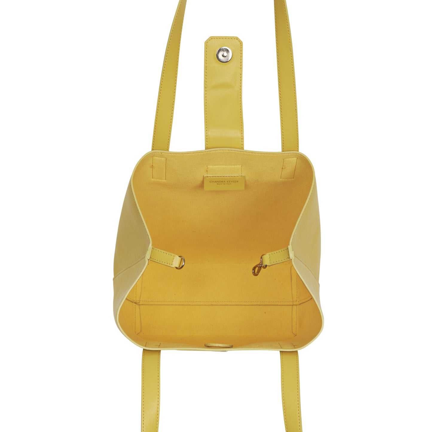 Lightweight bucket bag has two shoulder straps, snap closure, separate micro-suede zip pouch and inside clasp to contract and expand bag 100% leather, smooth matte texture Magnet snap closure Micro-suede lining Two shoulder straps, 10” drop Micro-suede zip pouch can easily be attached to inside of bag Tote measures: 12”h x 11”w x 4”d Pouch measures: 5”h x 8”w x .5”d Dust bag included Handcrafted by artisans in a family-owned factory Exclusively Made in Italy Yellow