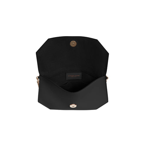 Cross body purse made with exceptional quality leather. Carry as an evening bag or clutch with removable chain strap. Sleek design comfortably fits a phone, sunglasses and keys.  100% smooth matte leather Magnet snap closure Micro-suede lining, with inside open pocket Detachable chain shoulder strap, 22” drop Measures: 5.5”h x 8.5”w x .75”d Handcrafted by artisans in a family-owned factory Exclusively made in Italy